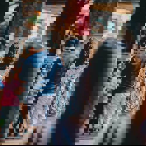 Crowd of people in a busy street.