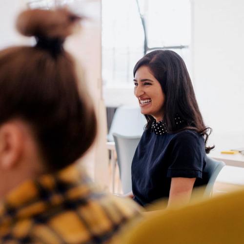 Woman smiling during a meeting