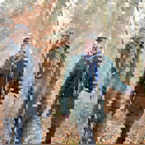 Two men walking in the forest